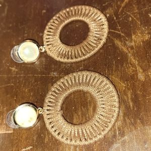 Beautiful woven earrings tan in color rose gold stud with gold flakes.